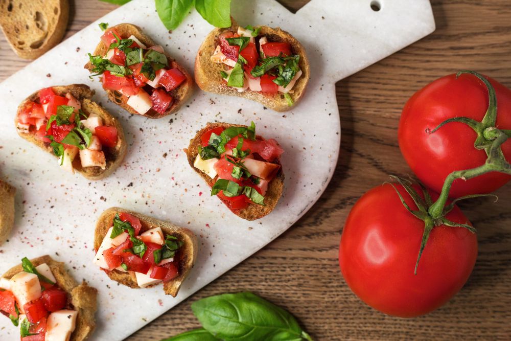 bruschetta with tomatoes and cutting board