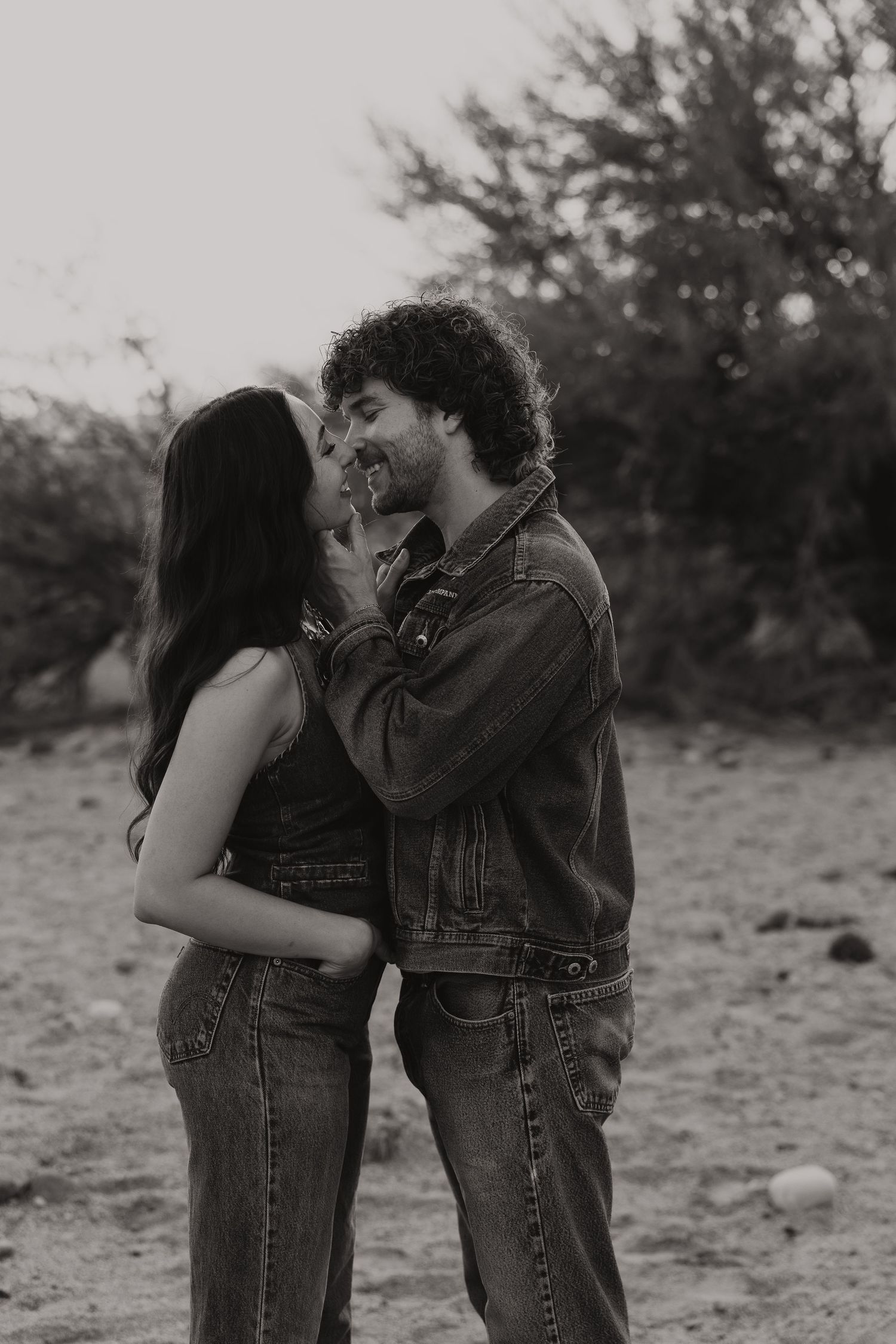 Heartwarming outdoor photo series of playful moments in a grassy field.