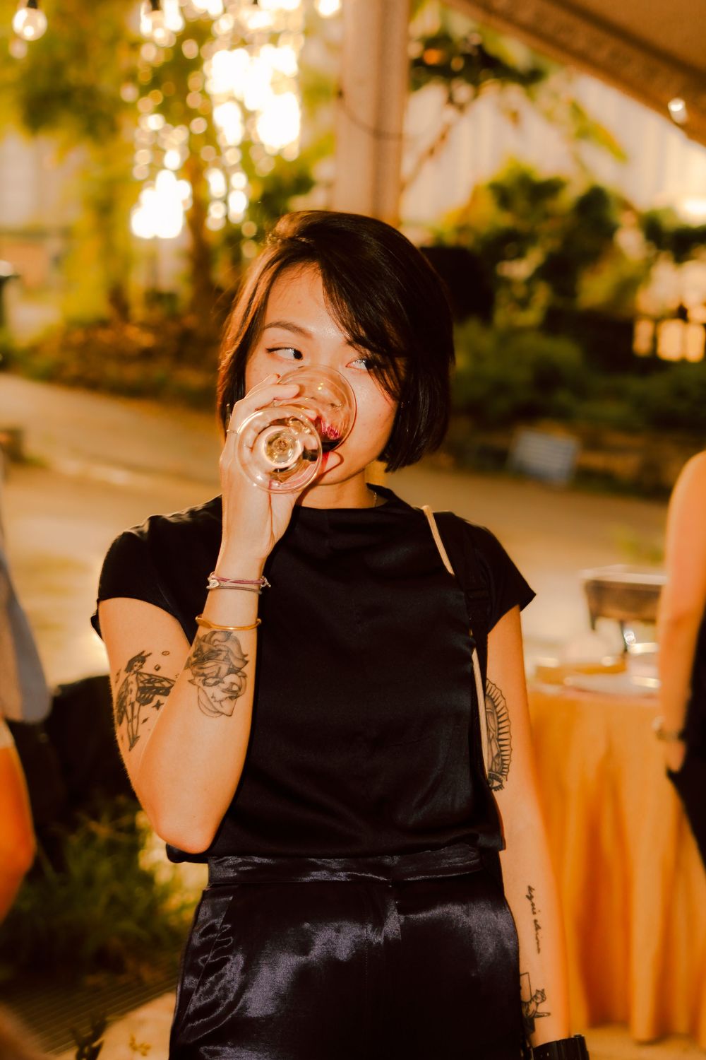 woman drinking from glass