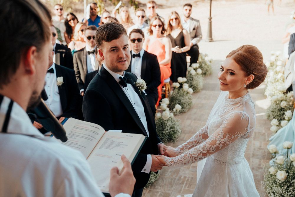 Candid wedding moments captured in a panoramic collage showing guests and celebration in an outdoor setting.