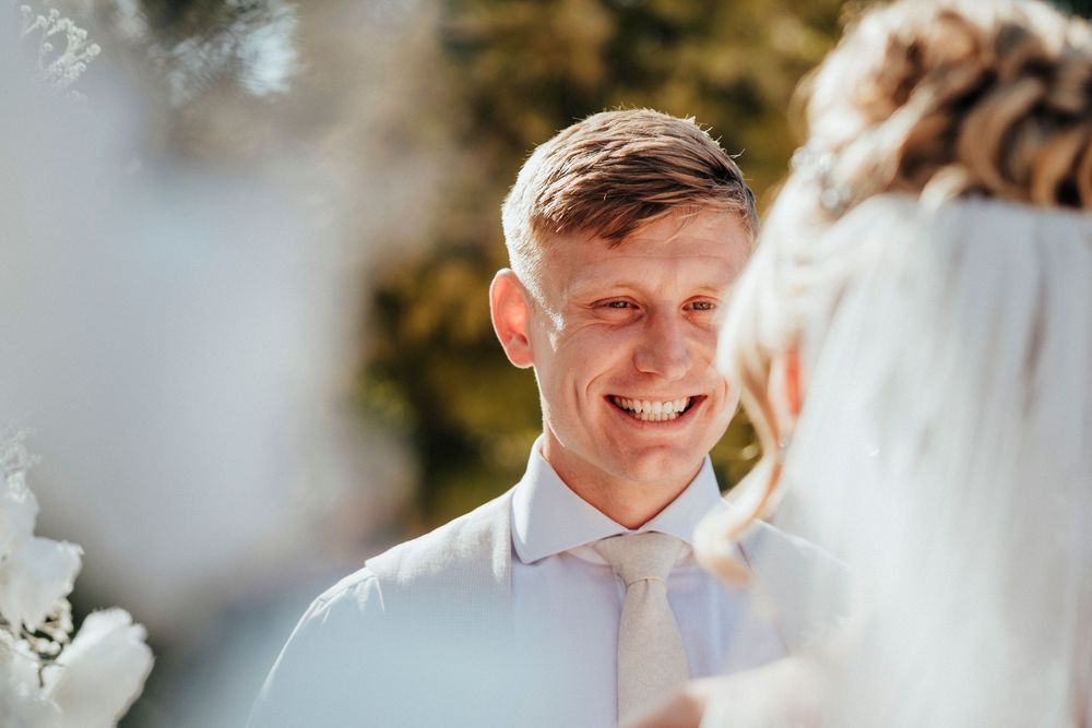 A tender moment shared between a couple during their outdoor wedding celebration.