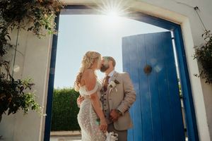A romantic couple shares tender moments in front of a blue door and garden setting in a wedding photo collage.