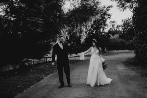 A black and white wedding photo sequence shows a couple walking down a tree-lined path together.