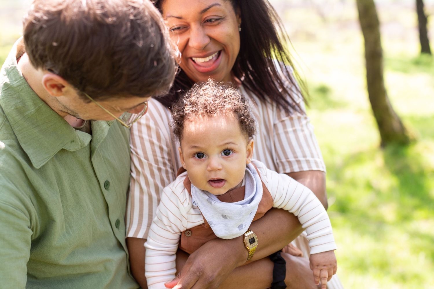 Family sharing joyful moment together outdoors in natural setting.
