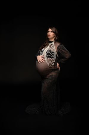 A maternity photo series showing a pregnant woman in a black dress with pearl necklaces against a dark background.