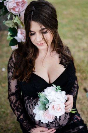 A bridal portrait series showing a black lace dress and soft pink bouquet against a natural outdoor background.