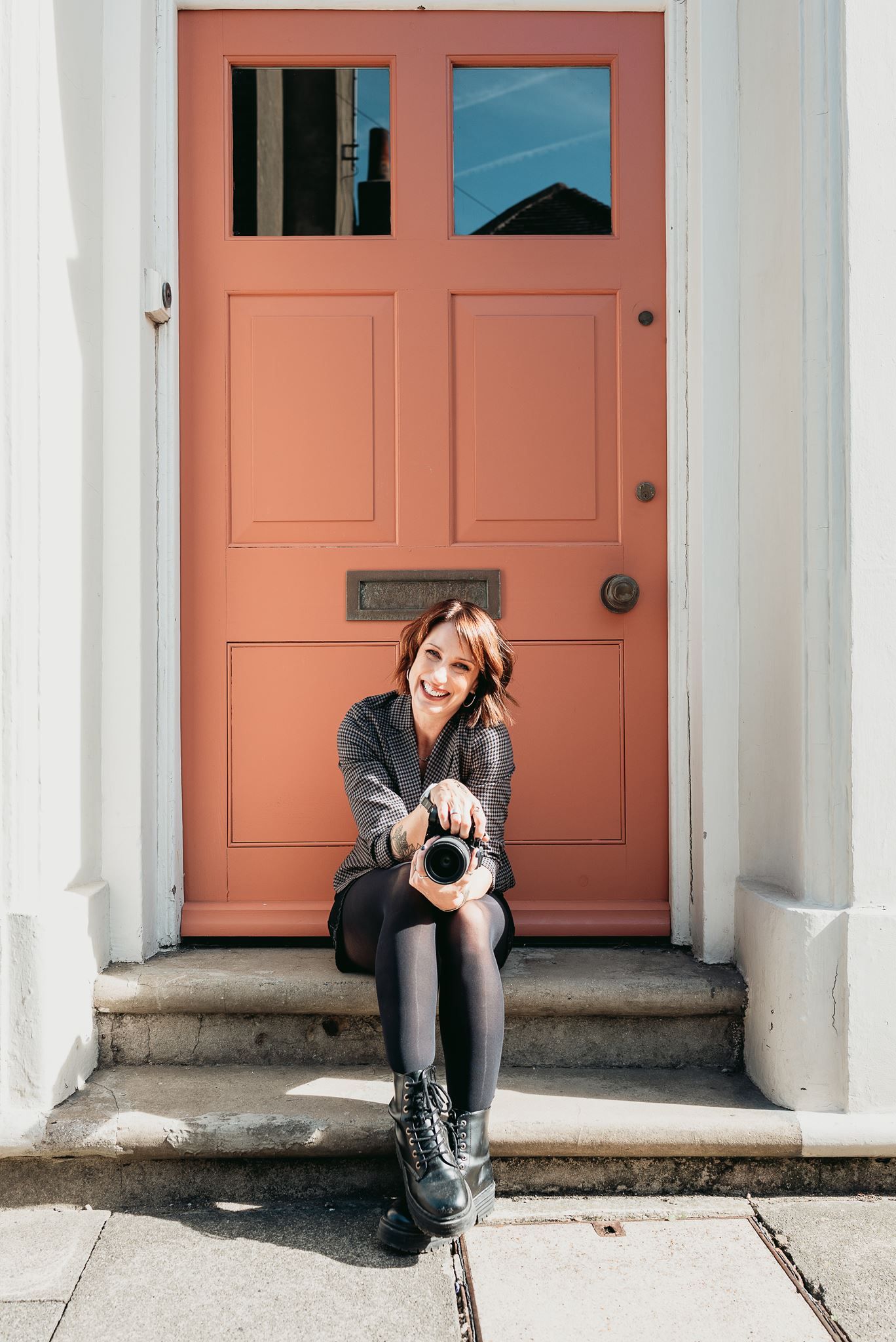 Portrait of a brand photographer at work on location in Deal, Kent