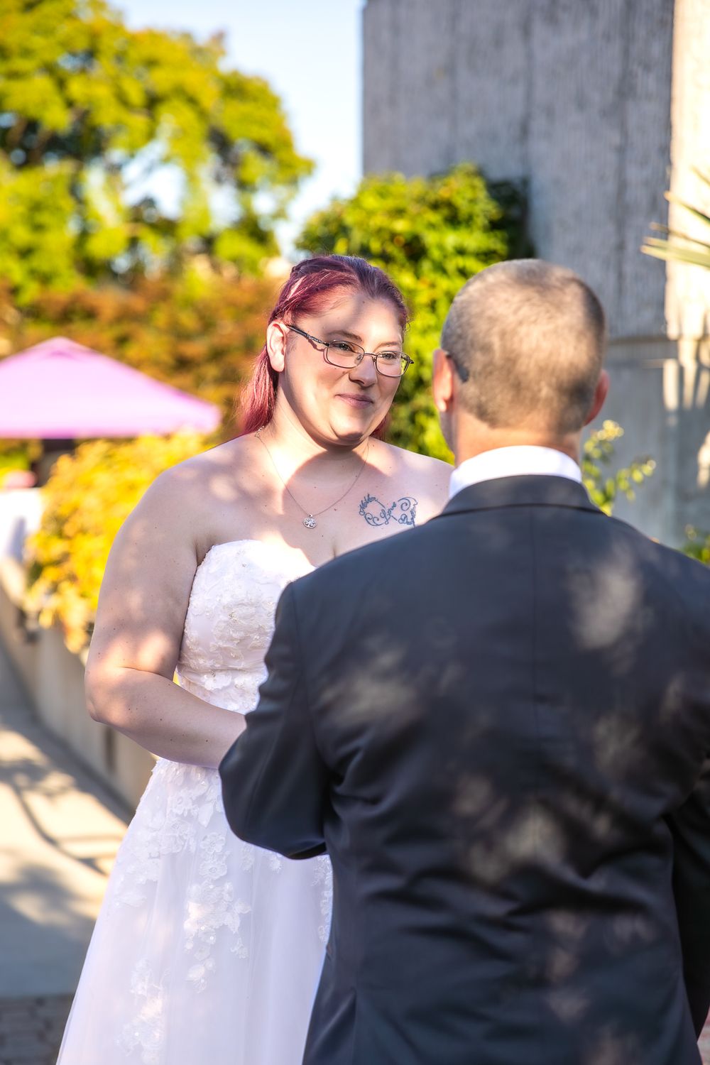 A couple shares an intimate moment during their outdoor wedding ceremony.