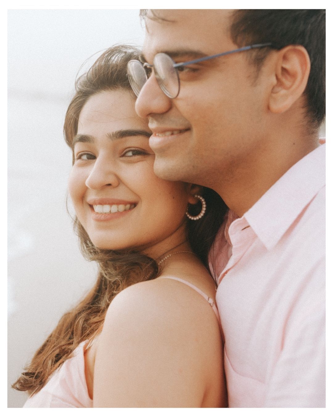 Tender close-up portraits of a couple embracing and smiling.