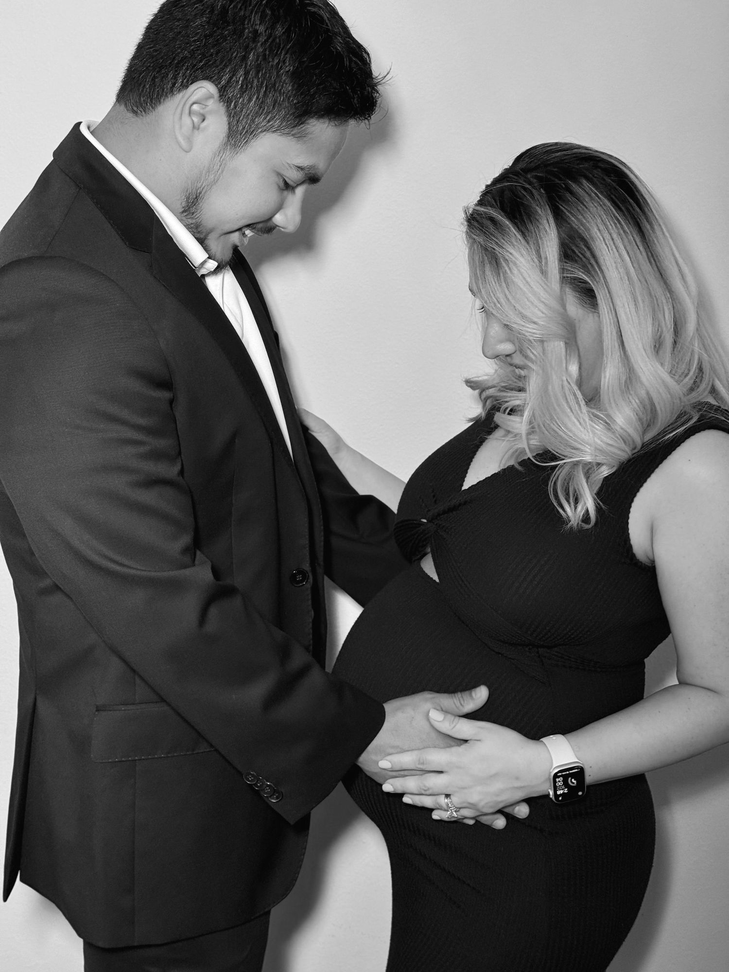 Black and white photo series showing tender moments between a couple.