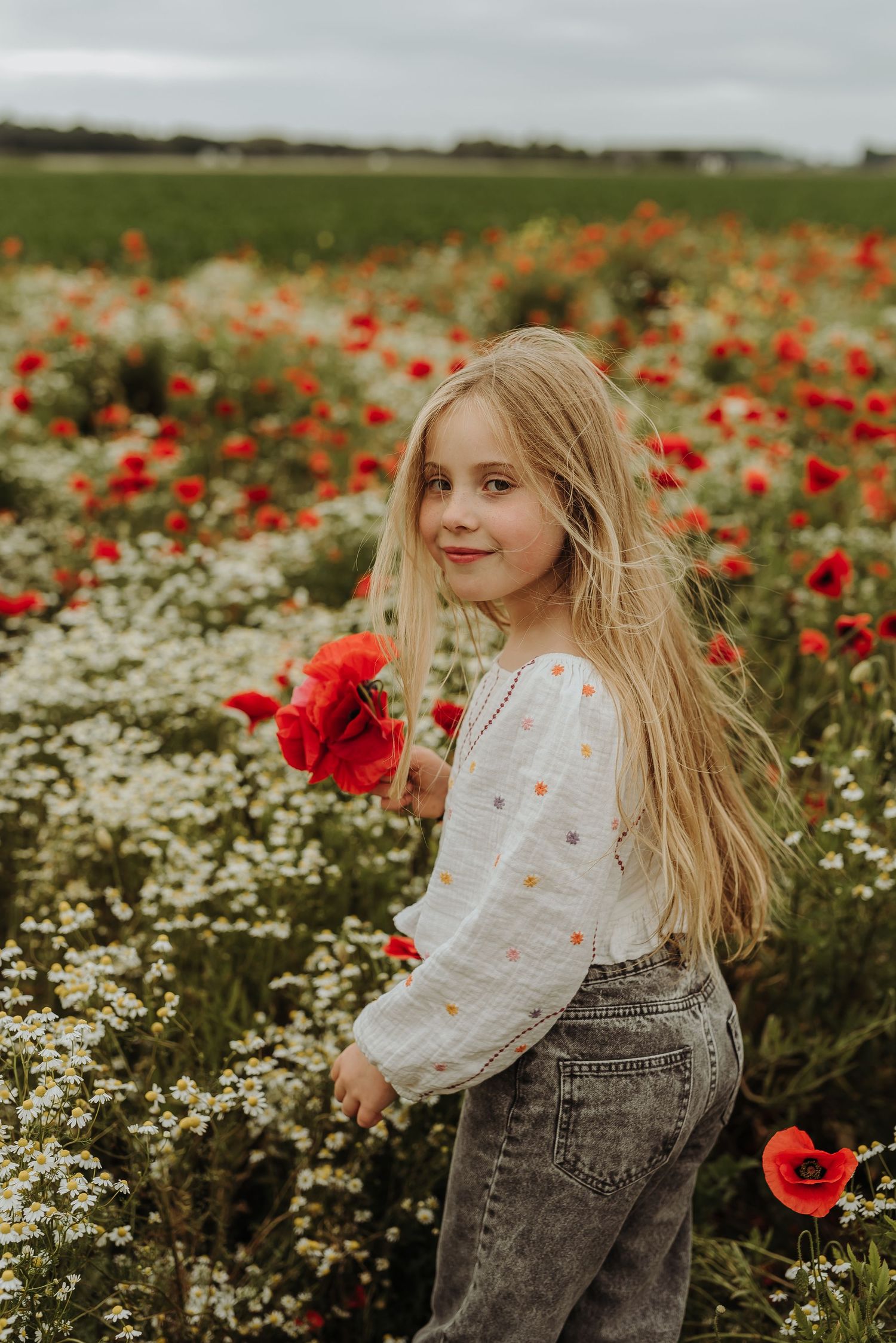 Fotoshoot tussen klaprozen