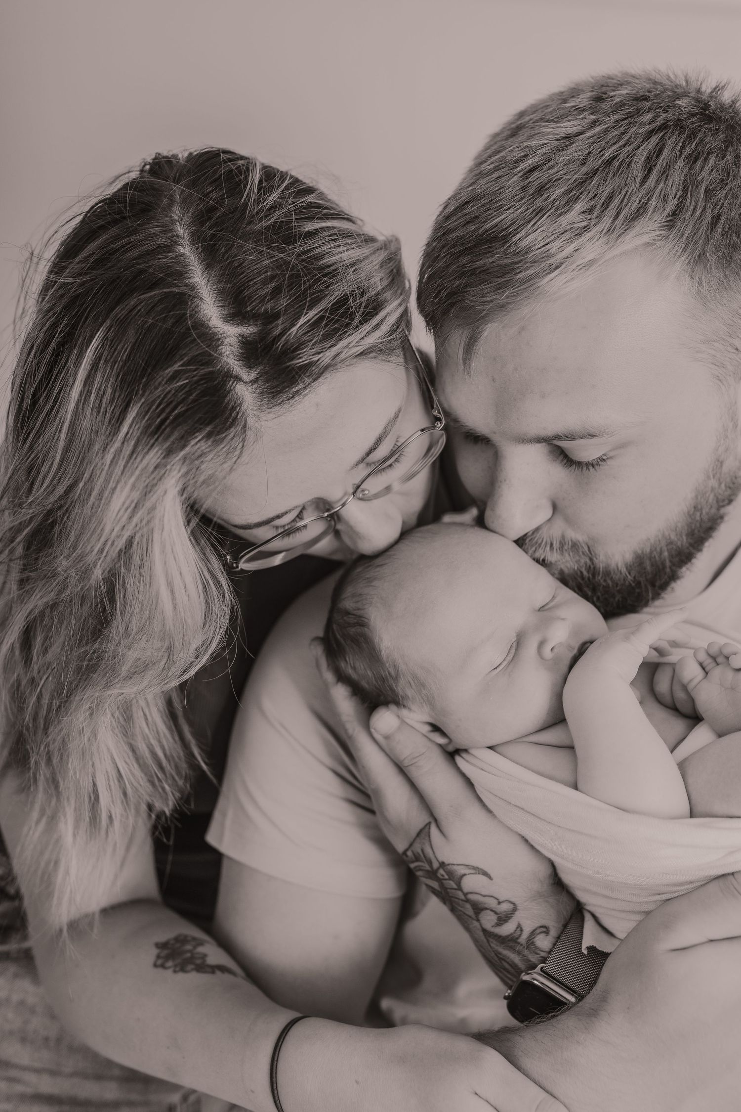Black and white photographs capturing gentle moments between parents and their newborn.  Photographer. Hull. East Yorkshire. Photography