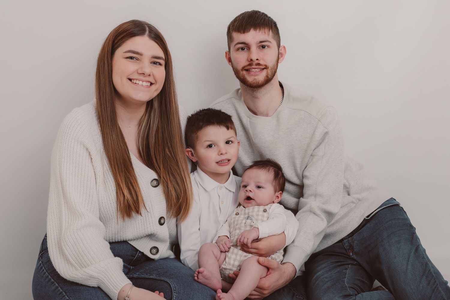 Casual family portrait session with neutral coloured clothing against white backdrop. Photographer. Hull. East Yorkshire. Photography