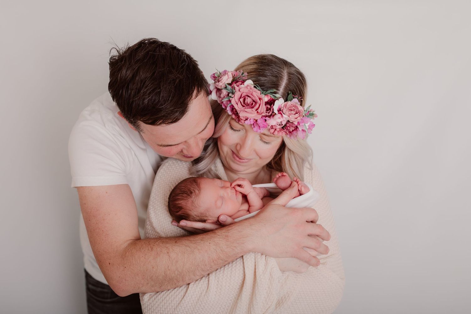 Sweet family moments captured with soft pink floral accents and gentle embraces. Photographer. Hull. East Yorkshire. Photography