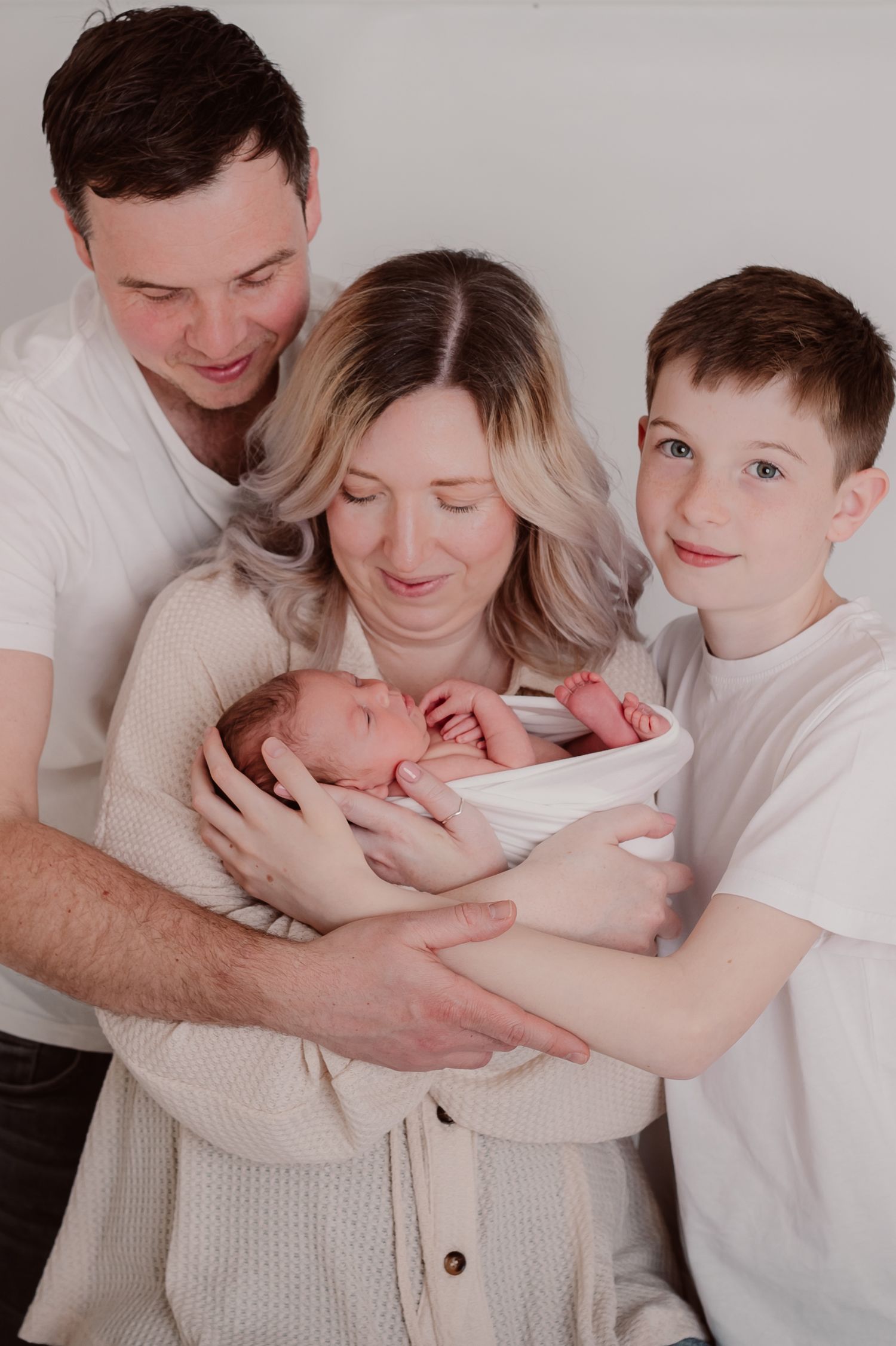 Tender family photo series with neutral tones showing loving interactions and cuddles. Photographer. Hull. East Yorkshire. Photography