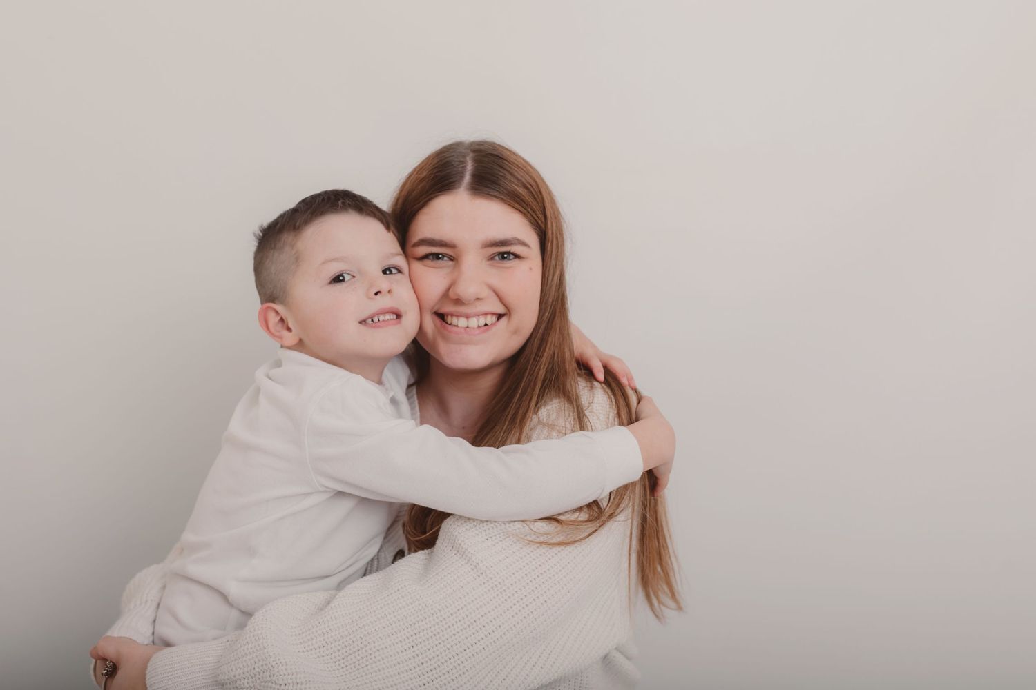 Candid family moments captured during white backdrop photo session. Photographer. Hull. East Yorkshire. Photography