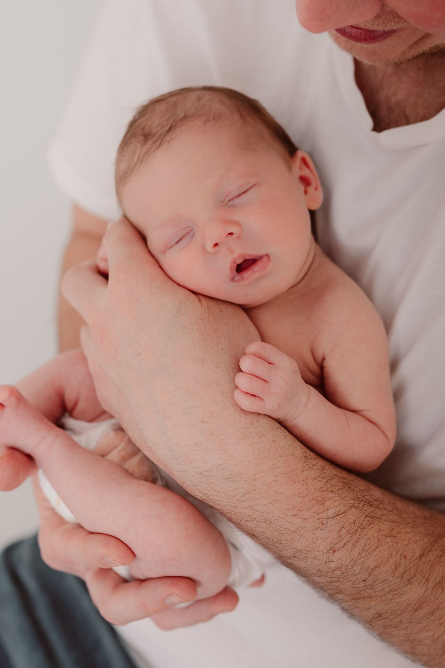 Close-up newborn photography series capturing delicate details and gentle parental touch. Photographer. Hull. East Yorkshire. Photography