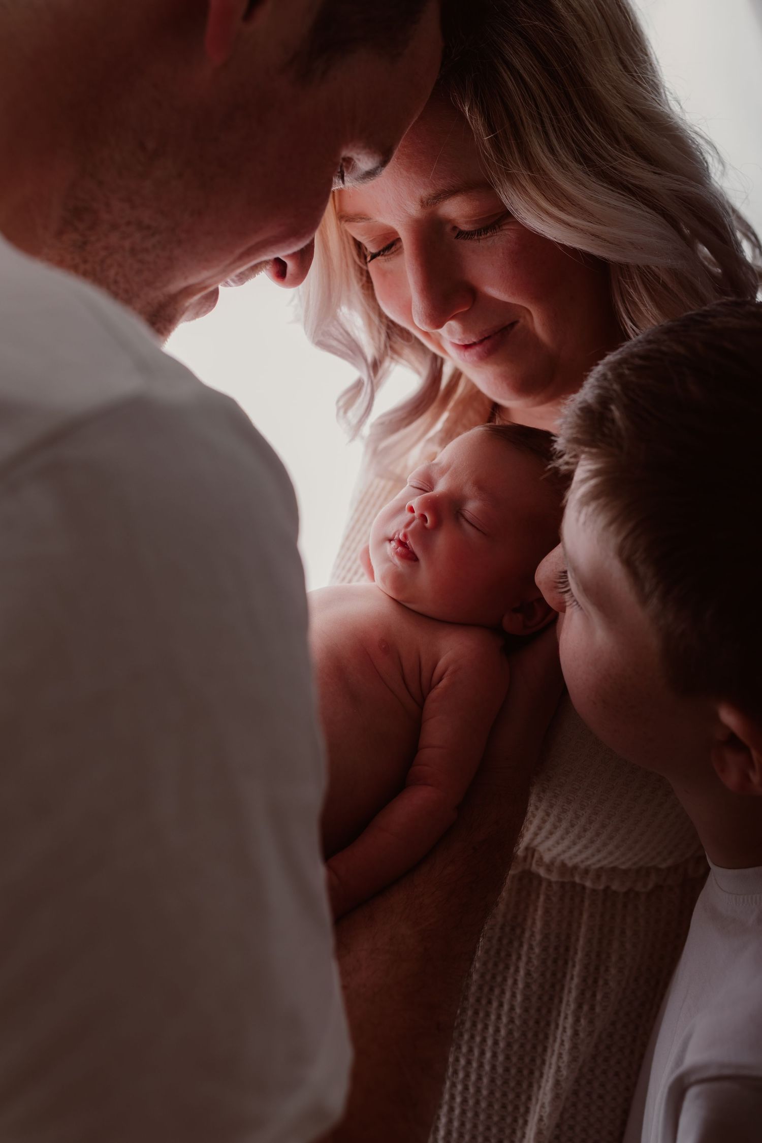 Intimate close-up portrait showing tender family moments in warm lighting. Photographer. Hull. East Yorkshire. Photography