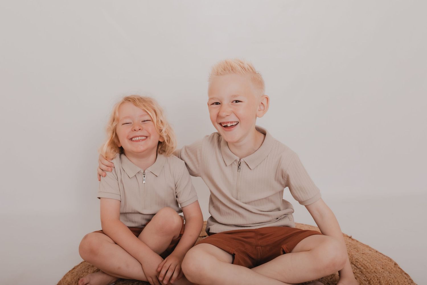 Series of joyful studio portraits with two children on textured background. Photographer. Hull. East Yorkshire. Photography