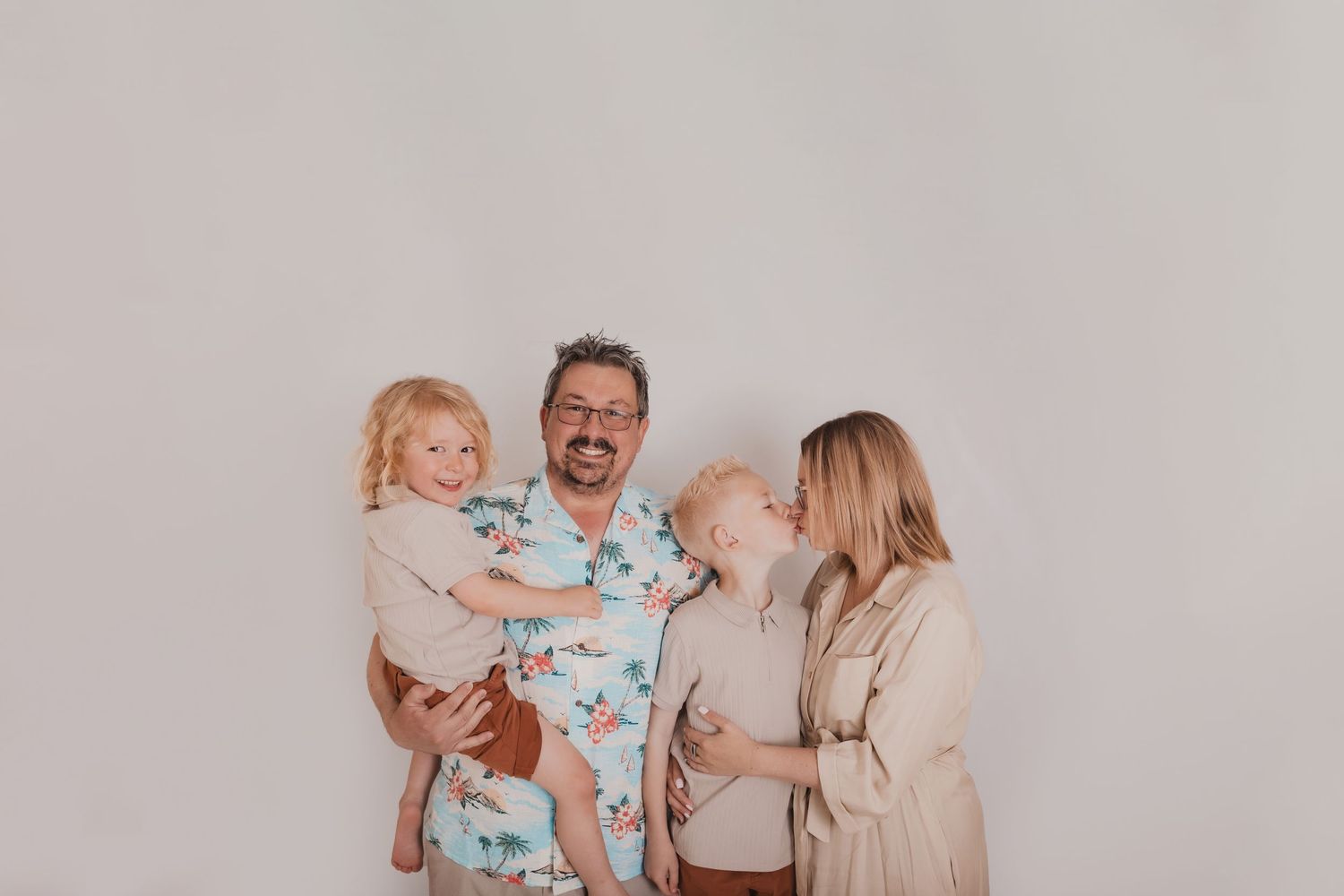 Candid family portrait showing genuine laughter and joy in matching outfits. Photographer. Hull. East Yorkshire. Photography