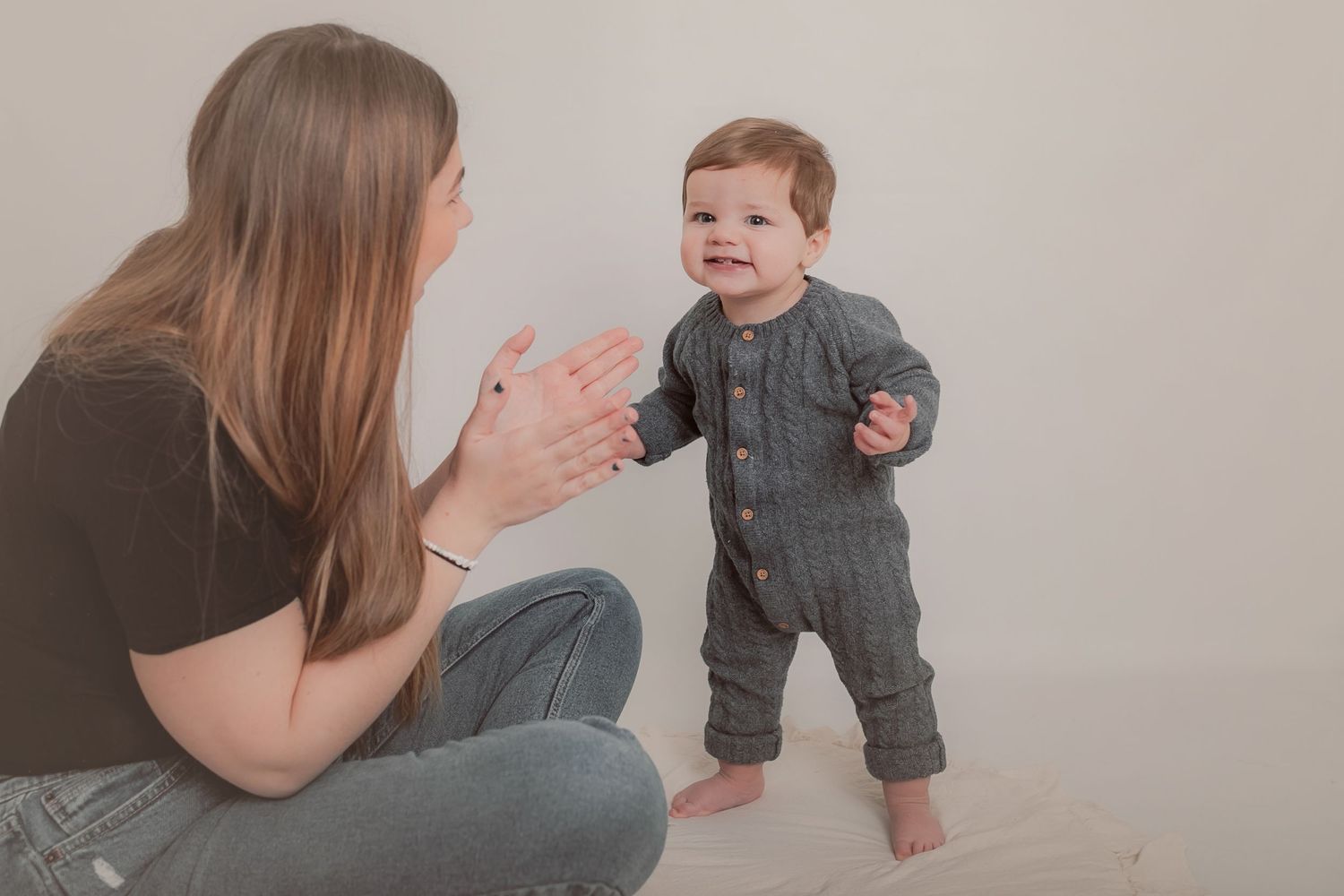 Mother and baby in casual clothes playing during photo session. Photographer. Hull. East Yorkshire. Photography