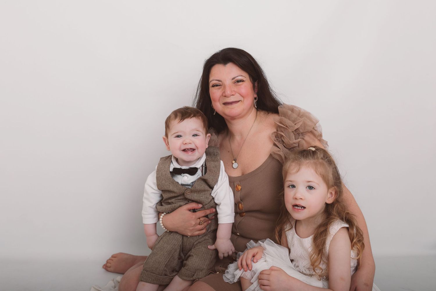 Studio family portrait session with casual poses against white background. Photographer. Hull. East Yorkshire. Photography