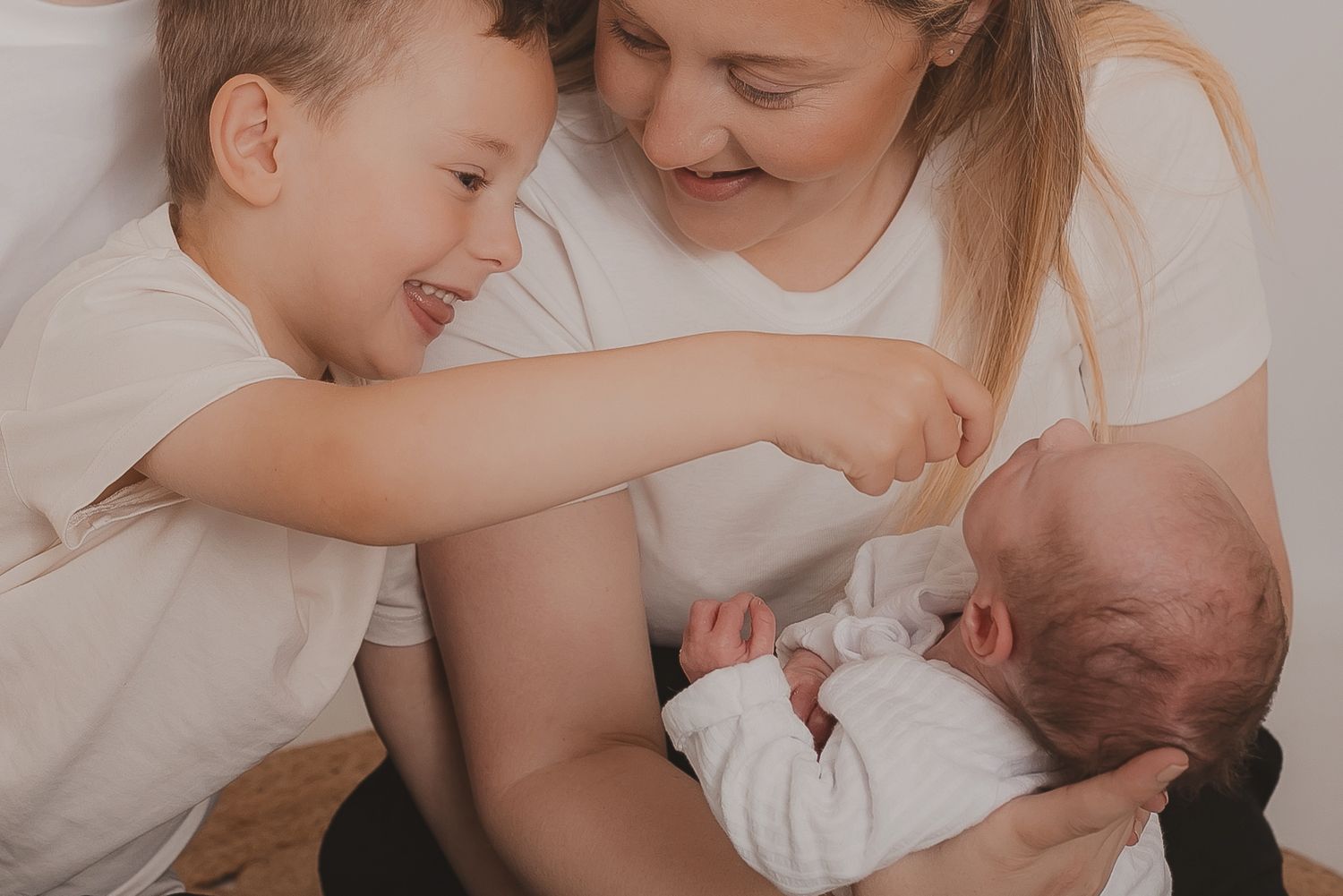 Candid family moments captured in soft natural light against white background. Photographer. Hull. East Yorkshire. Photography
