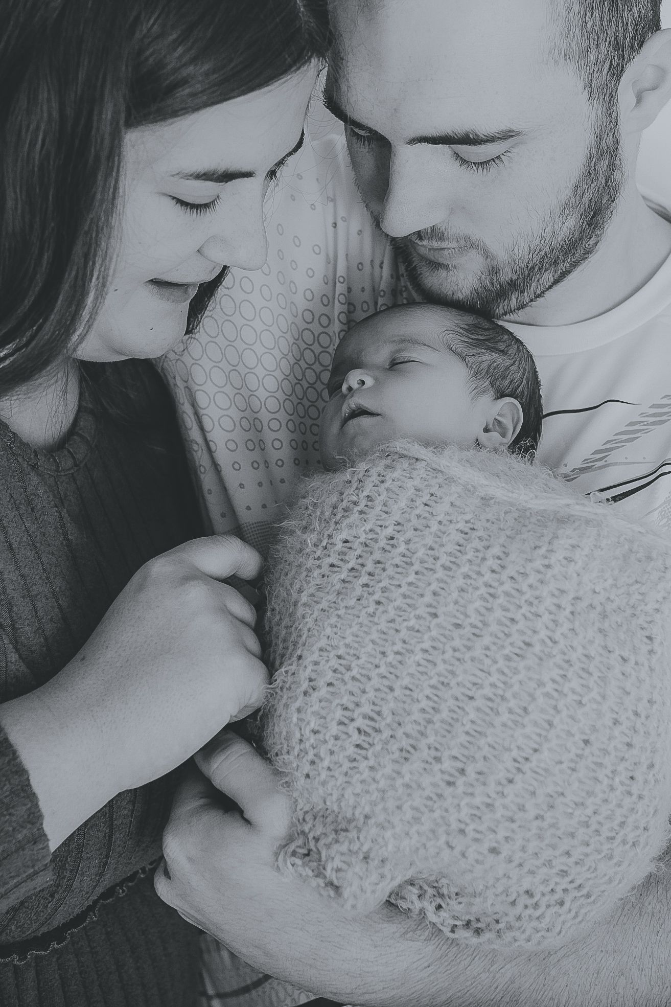 Black and white intimate family photos with newborn baby swaddled in knitted blanket. Photographer. Hull. East Yorkshire. Photography