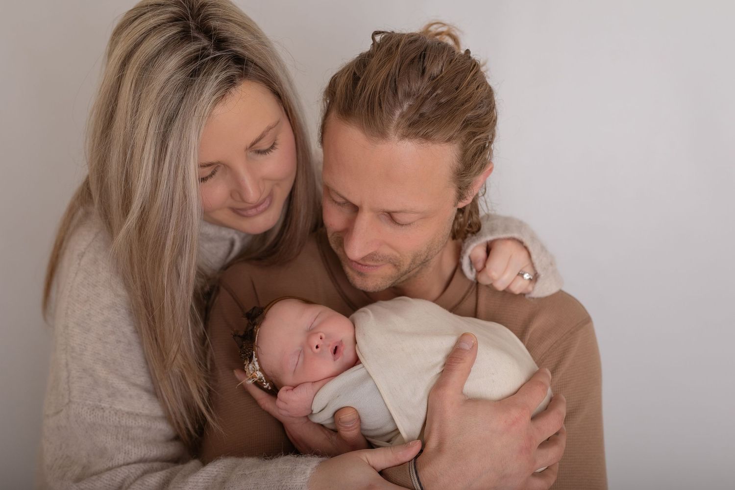 Intimate lifestyle photography session with gentle embraces on light background.  Photographer. Hull. East Yorkshire. Photography