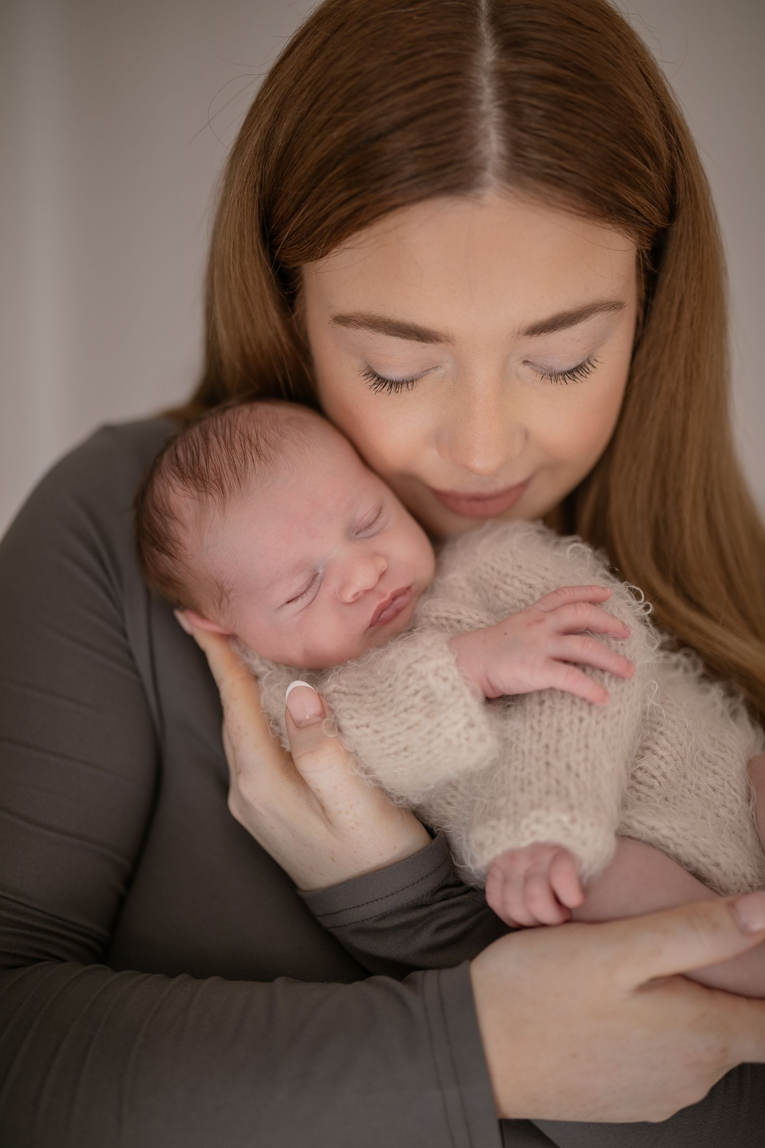 Tender moment between mother and newborn during professional photo shoot. Photographer. Hull. East Yorkshire. Photography