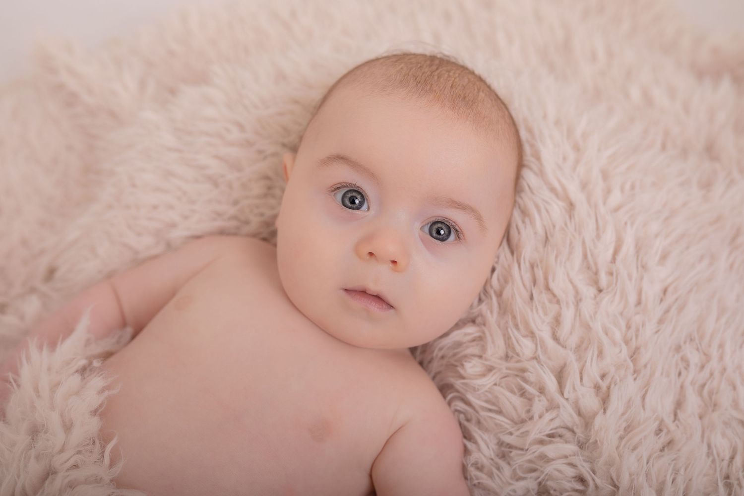 Sweet newborn photography on pink plush blanket showing baby's delicate features.  Photographer. Hull. East Yorkshire. Photography