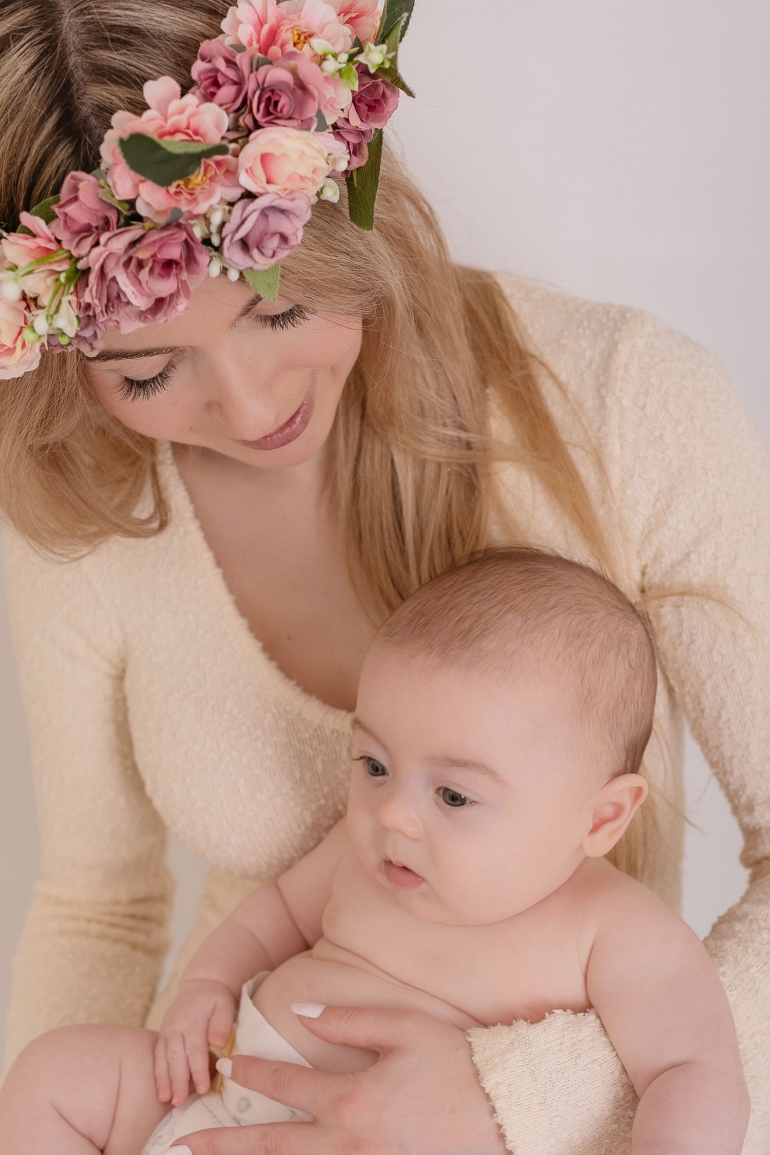Dreamy portraits with pink floral crowns featuring mother and baby in soft natural light.  Photographer. Hull. East Yorkshire. Photography