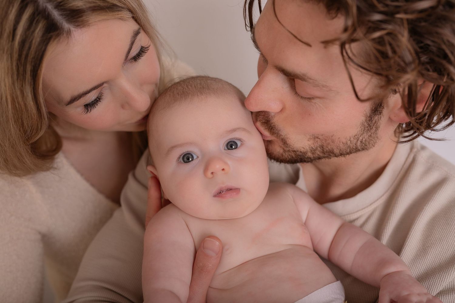 Gentle family moments captured in warm neutral tones showing affection and connection.  Photographer. Hull. East Yorkshire. Photography