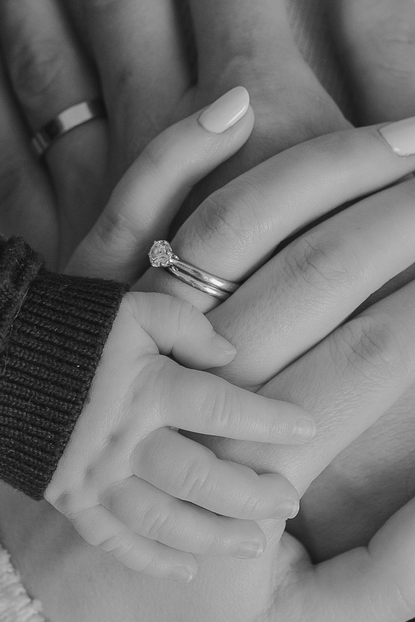 Close-up black and white photo of hands with engagement ring and wedding band.  Photographer. Hull. East Yorkshire. Photography