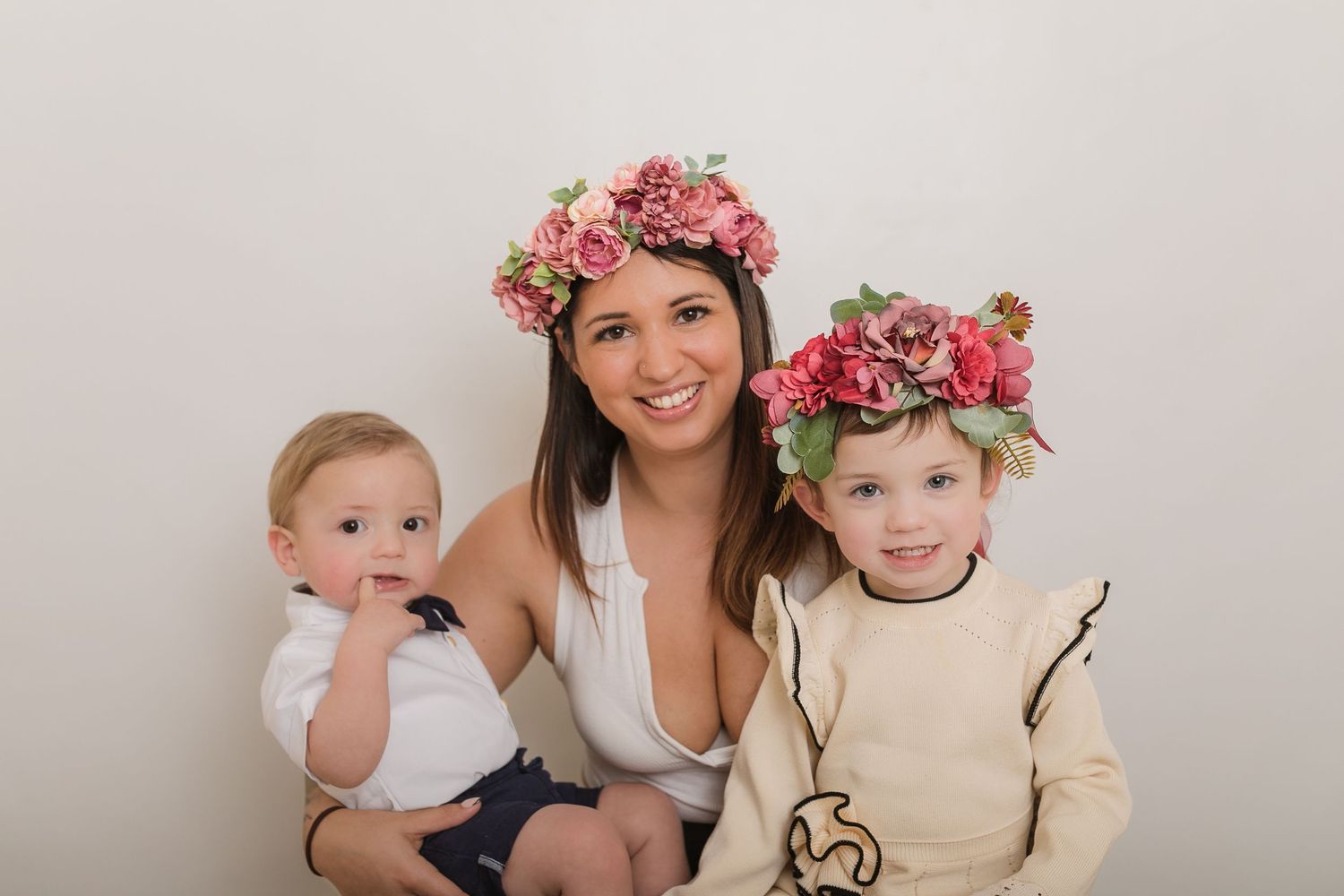 Spring portrait with pink flower crowns against neutral background. Photographer. Hull. East Yorkshire. Photography