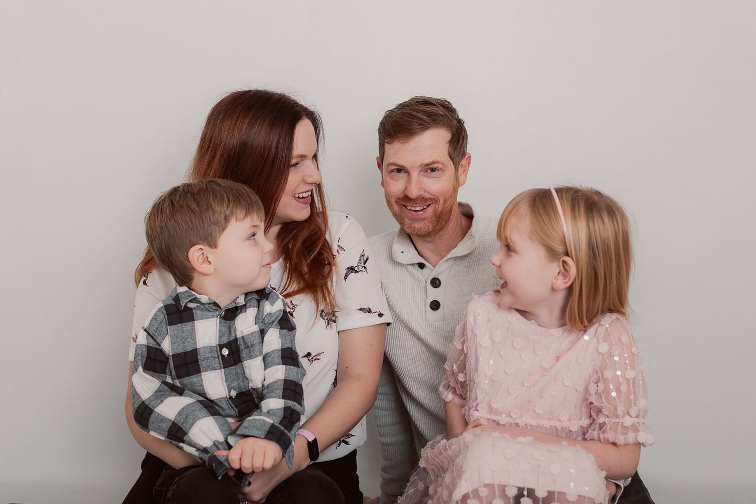 Family photo session with coordinated outfits in pink, gray and plaid patterns. Photographer. Hull. East Yorkshire. Photography