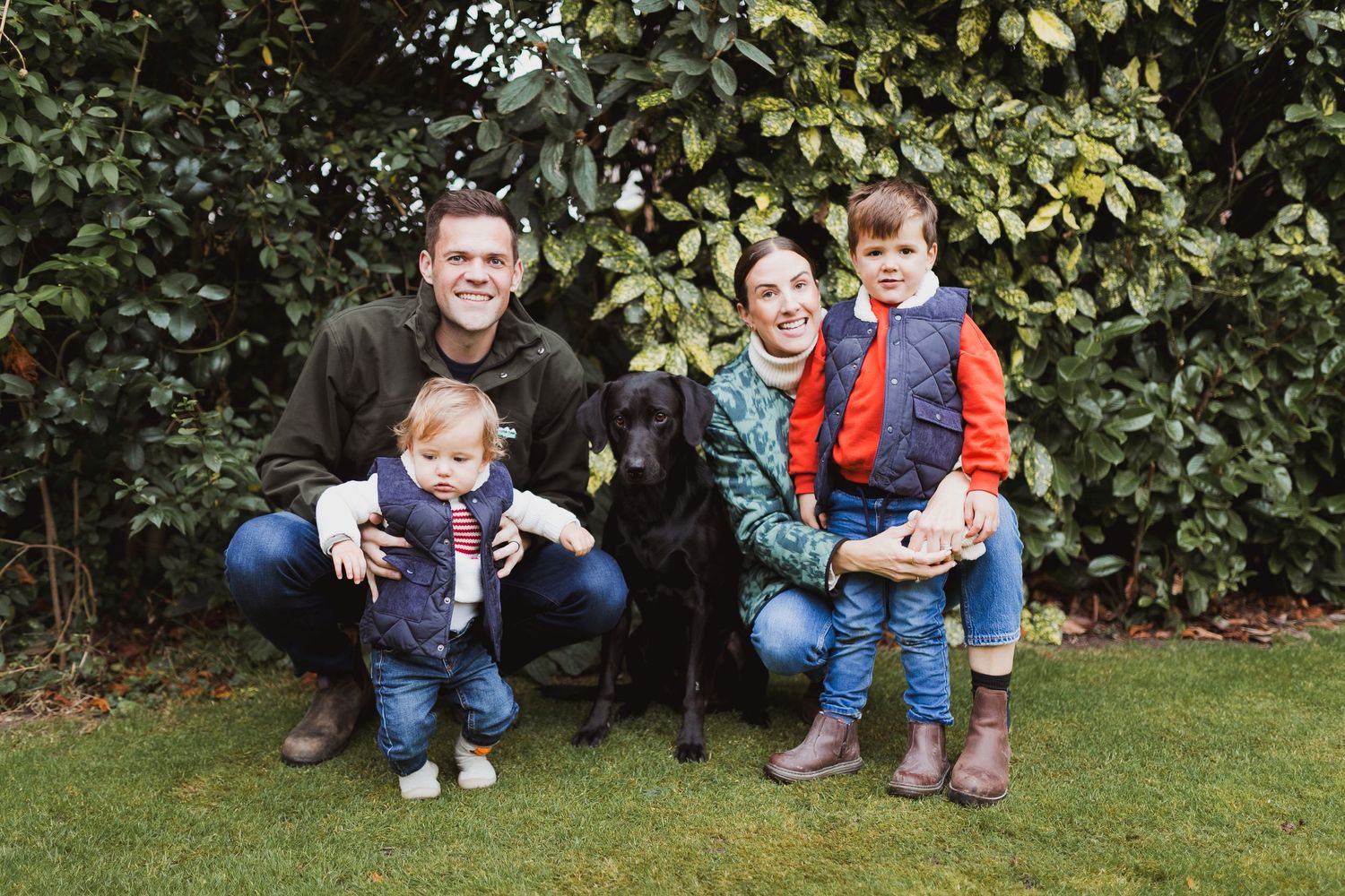 Outdoor family photo series with children playing in casual outfits against garden backdrop. Photographer. Hull. East Yorkshire. Photography