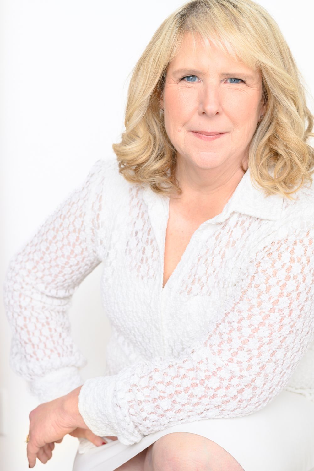 Portrait series featuring a white lace top against bright white background.
