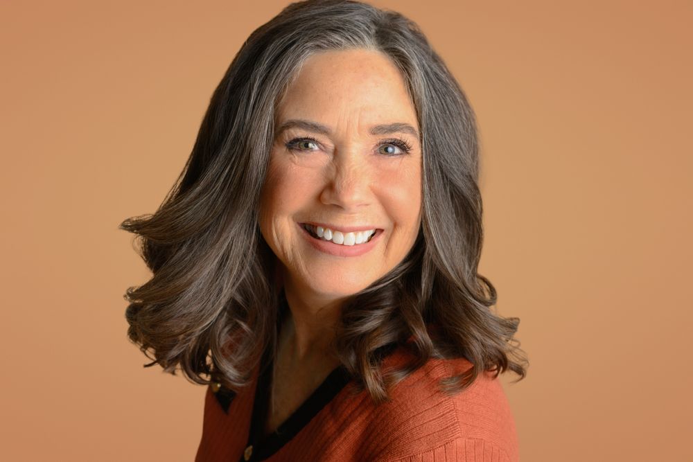 Professional headshot series showing warm expressions against a brown background.
