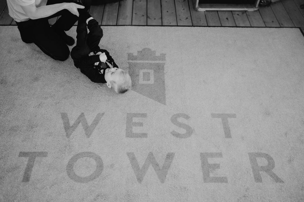 Black and white detail shot of West Tower branding on floor mat.