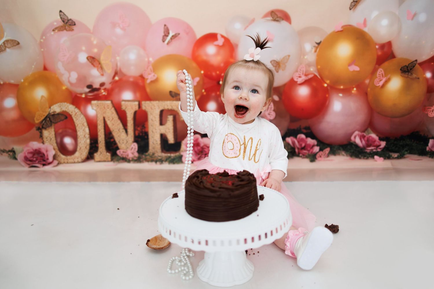 baby girl first birthday cake smash and splash balloon theme Tameside photographer photography