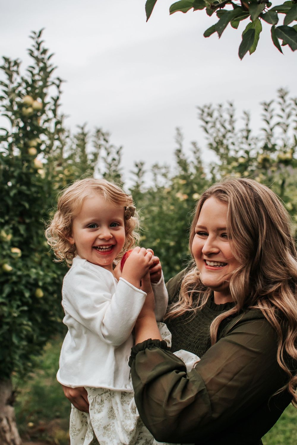 A heartwarming moment shared between mommy and me in an apple orchard in Benton City, Washington.