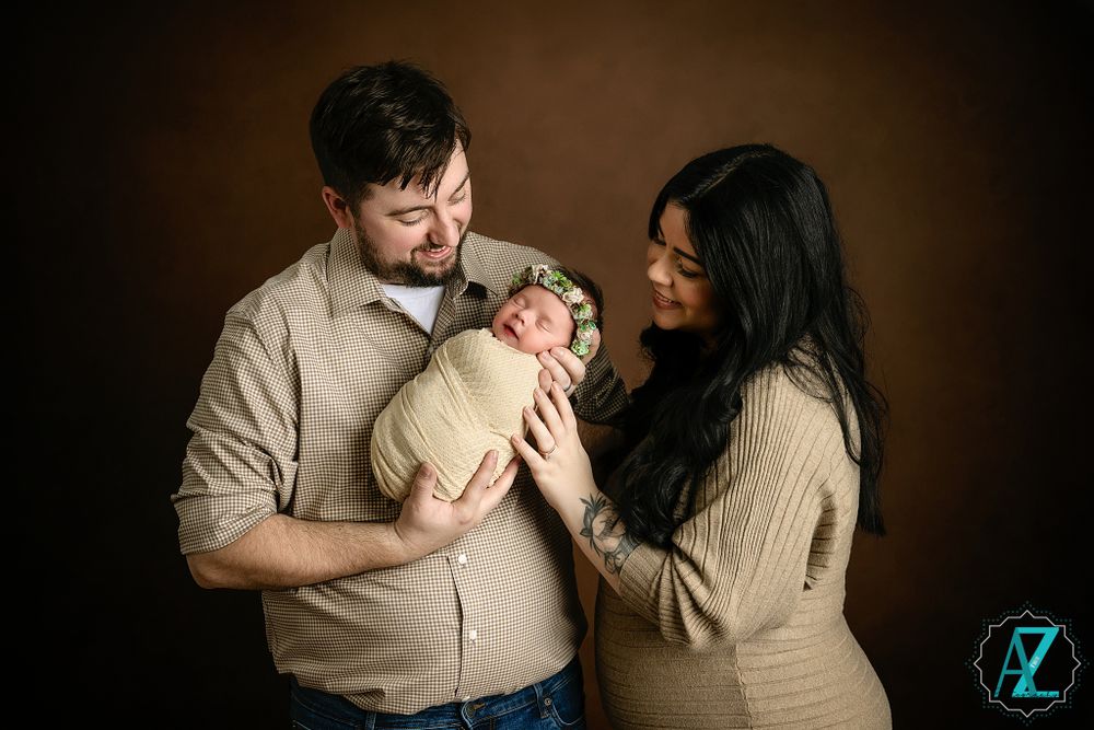 Candid family moment captured in warm tones against dark background.