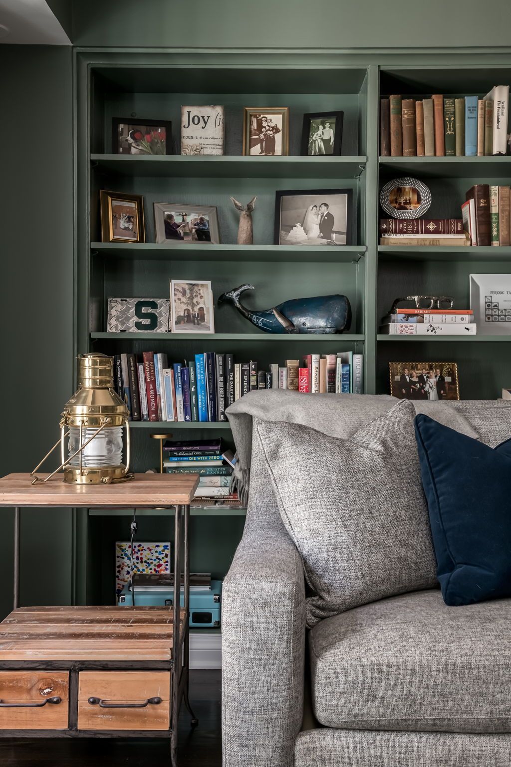 Dark academia inspired bookcase detail from real estate photography session in Chicago.