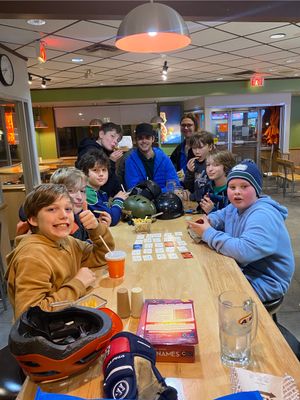 Youth at a table.