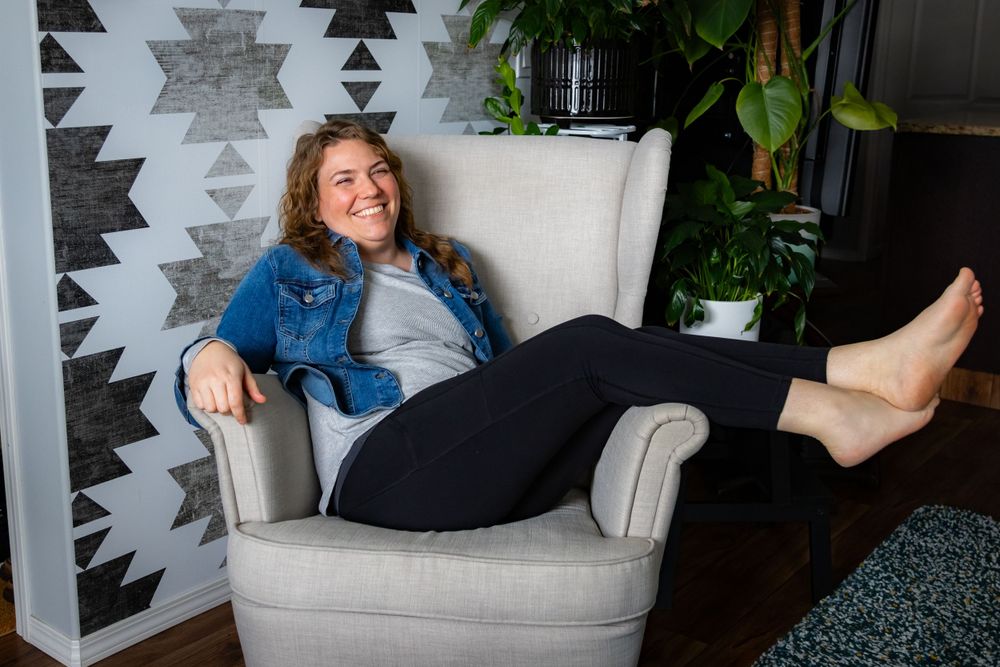 a woman sitting in a chair.