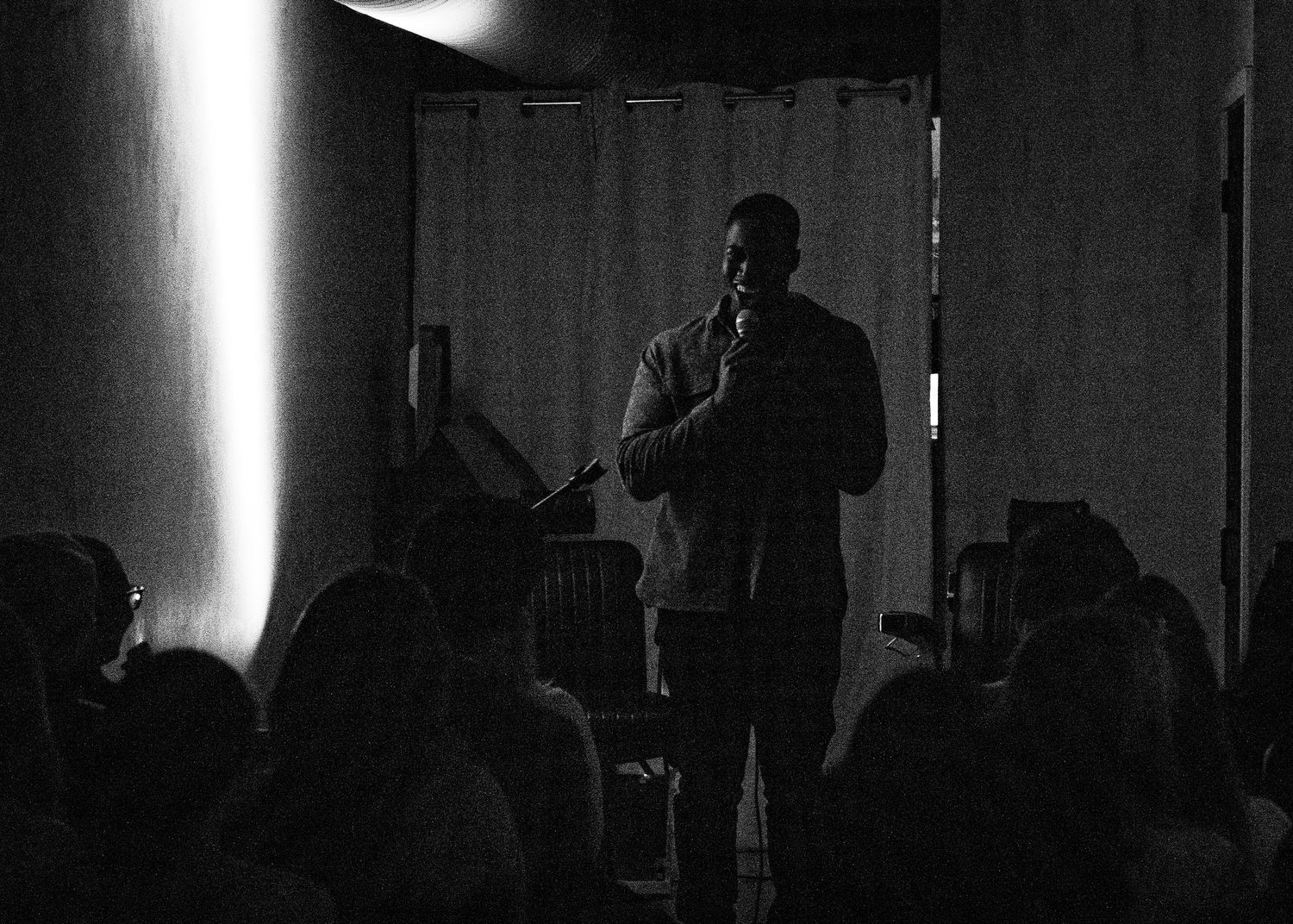 Event photography capturing live moments from the 'Mess Produced' comedy show with performers on stage