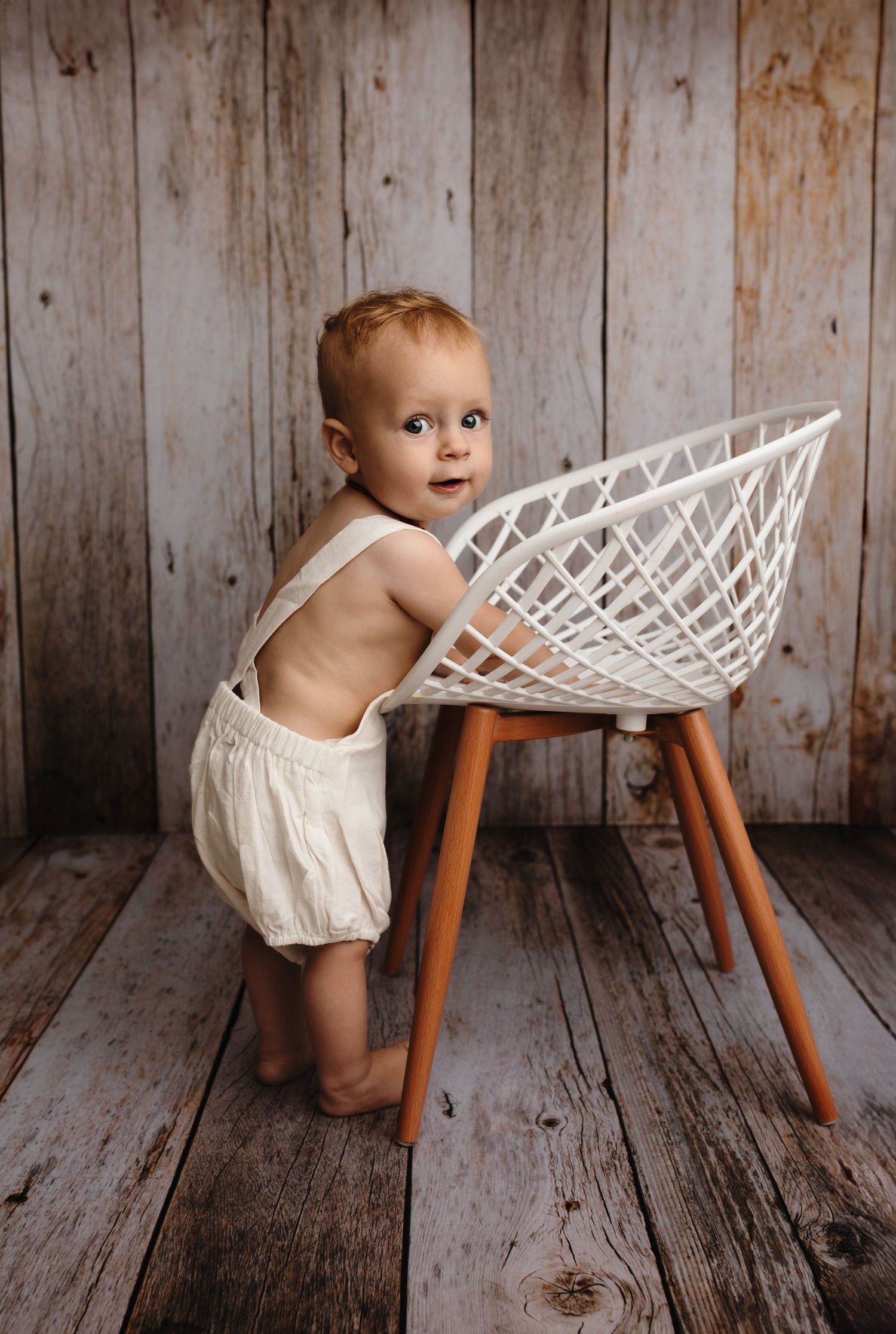 Charottesville photographer, baby, newborn, maternity, family, baby boy standing at chair in white romper and smiling
