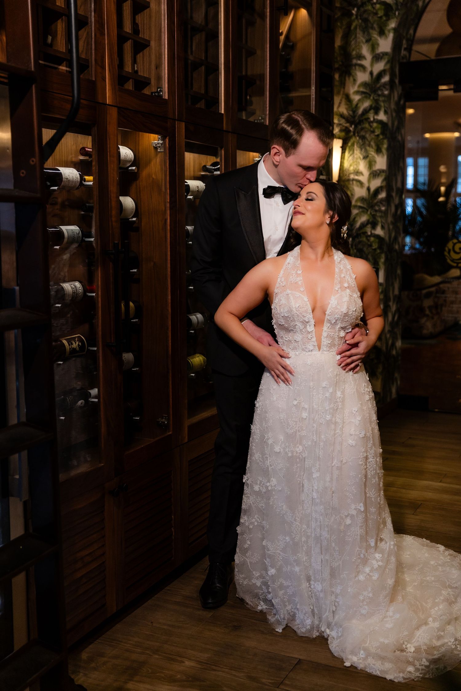 Intimate dance moment between newlyweds in a warmly lit indoor venue.