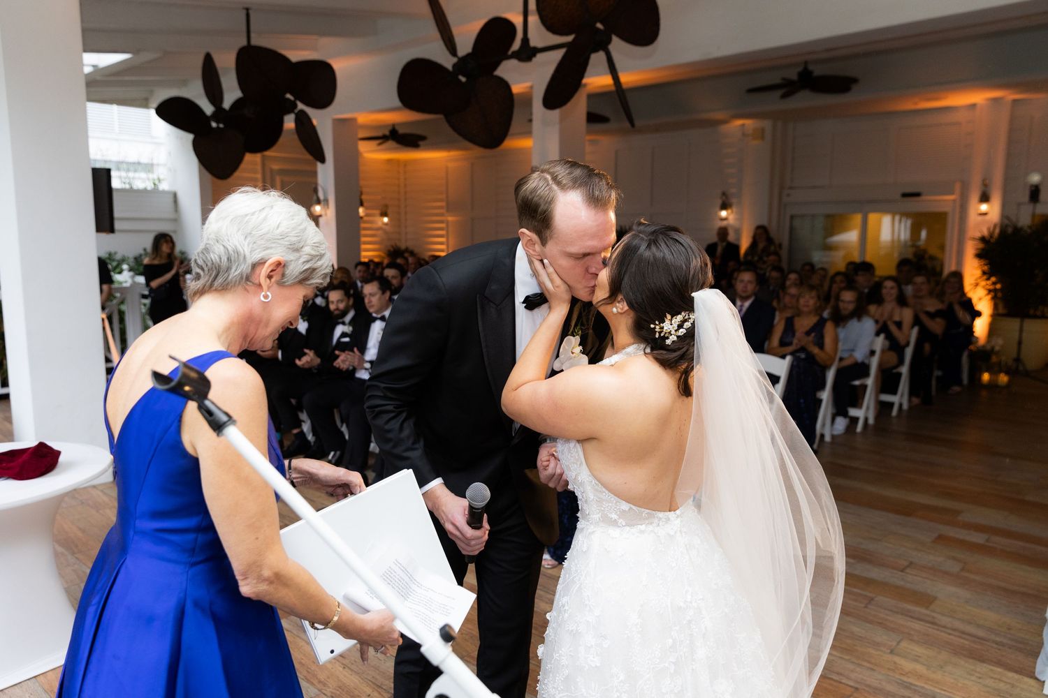 Wedding party members dancing and celebrating during the reception.